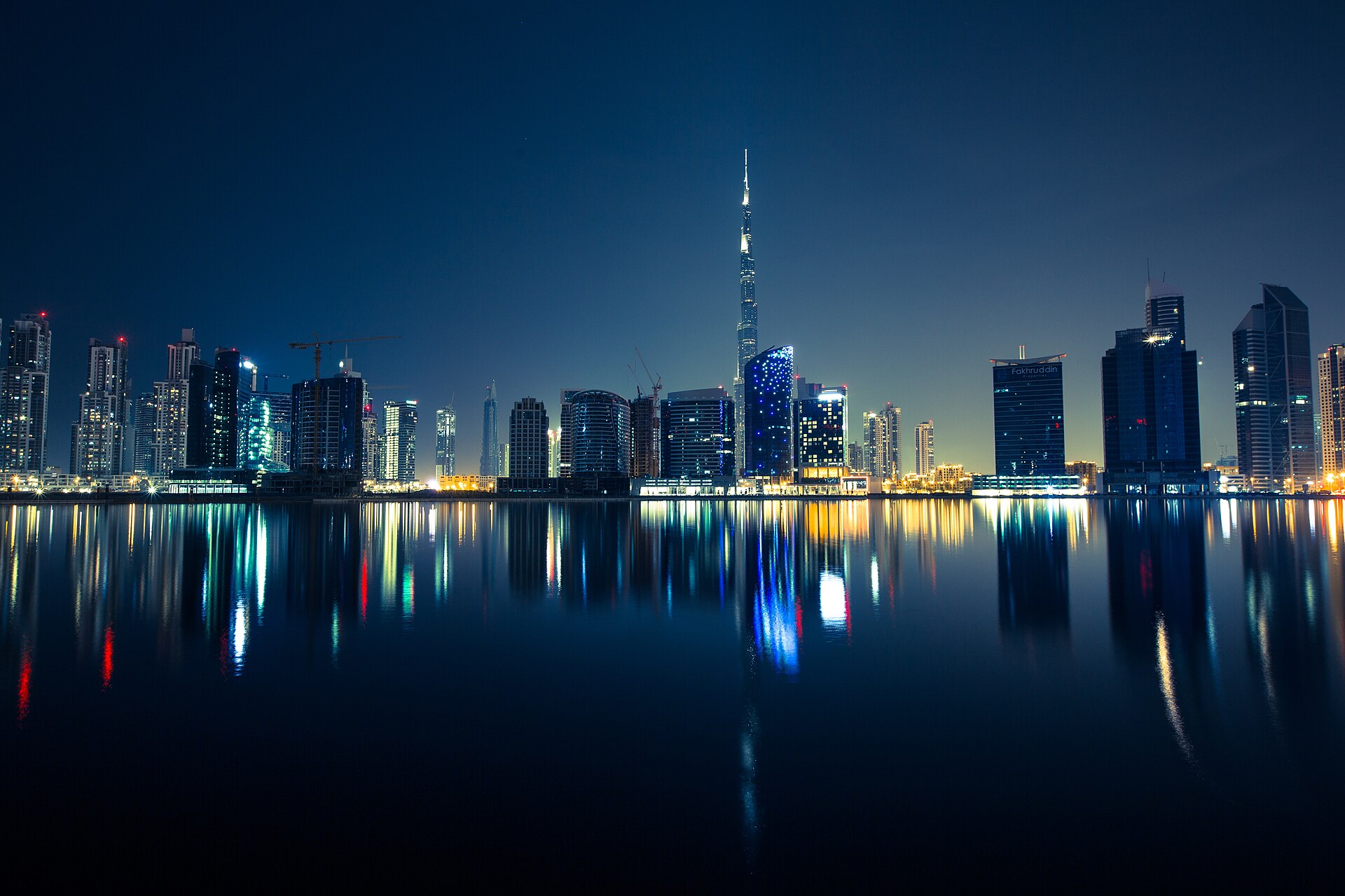 Dubai's dense downtown skyline of high-rise towers, illustrating cross-emirate commuter living enabled by Etihad Rail's 2026 passenger launch