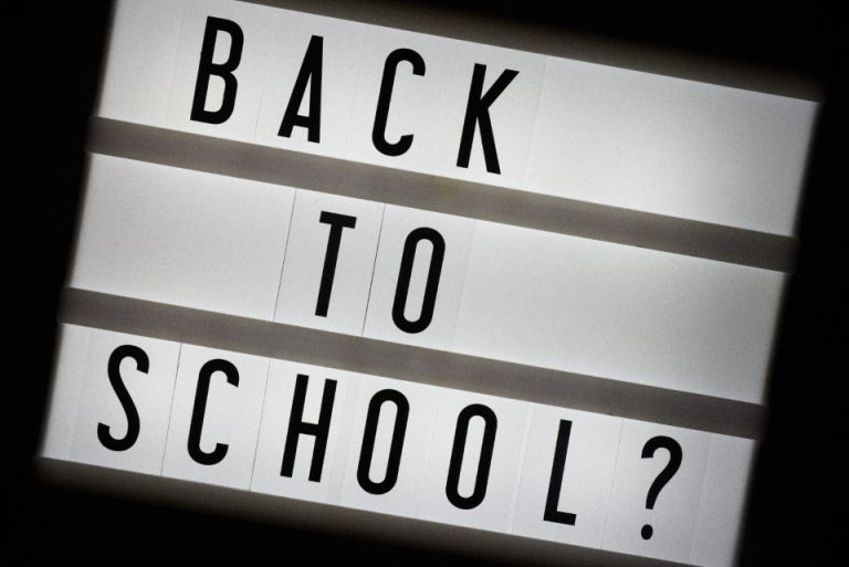 Illuminated lightbox sign reading "BACK TO SCHOOL?", illustrating UAE 2026-27 school admissions timing and the race to secure a school place