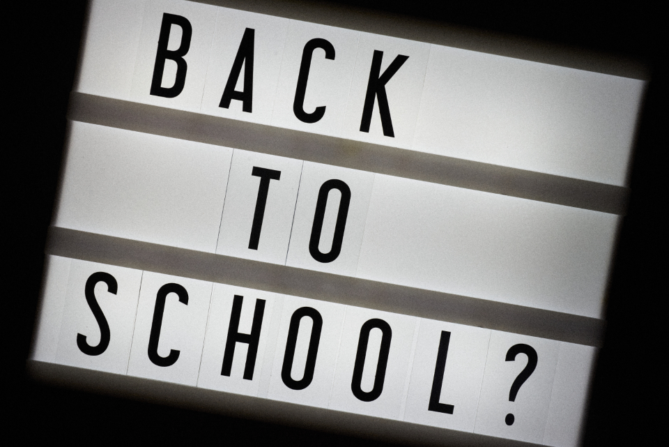 Illuminated lightbox sign reading "BACK TO SCHOOL?", illustrating UAE 2026-27 school admissions timing and the race to secure a school place